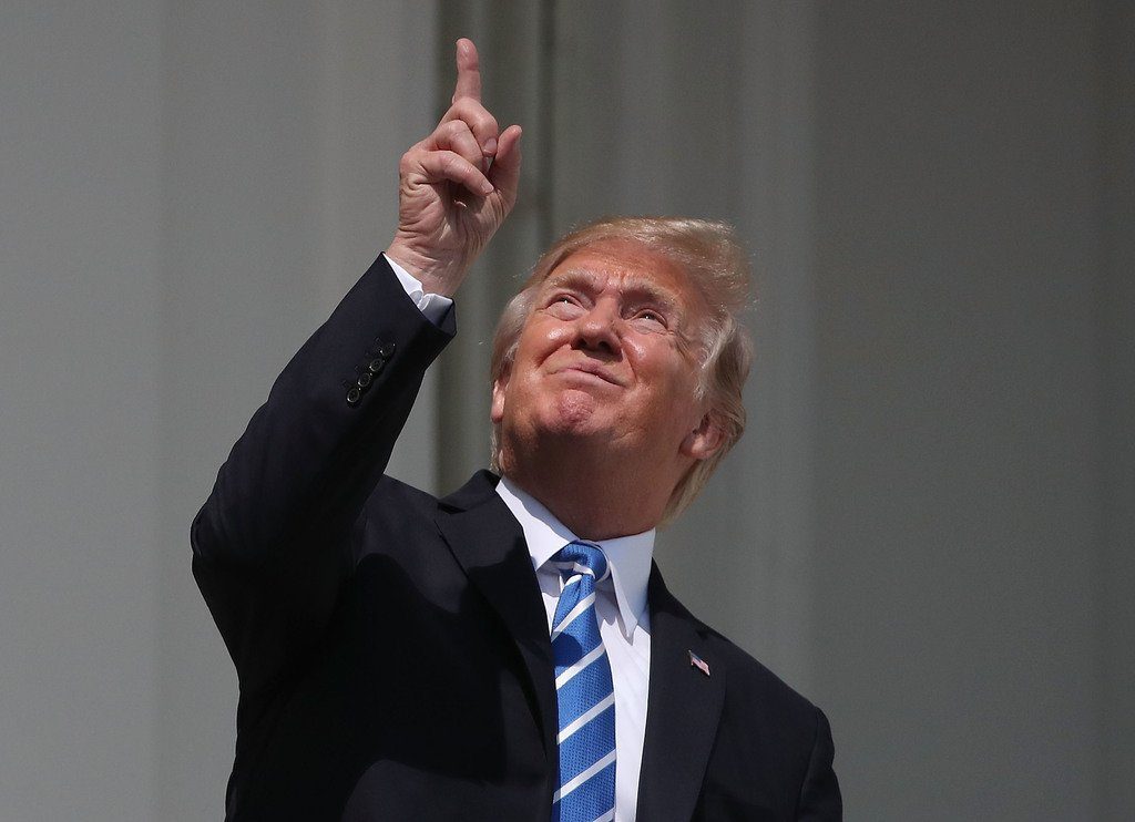 donald trump viewing the eclipse